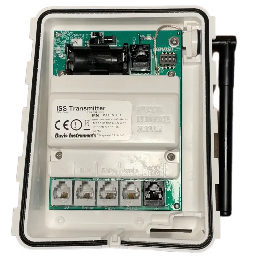 Davis Vantage Pro2 Wireless ISS Transmitter with the rear plastic case and connected antenna, showing the electronic components and connectors.